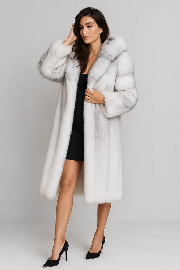 Full length view of women's white faux fur coat over black dress - luxury winter style